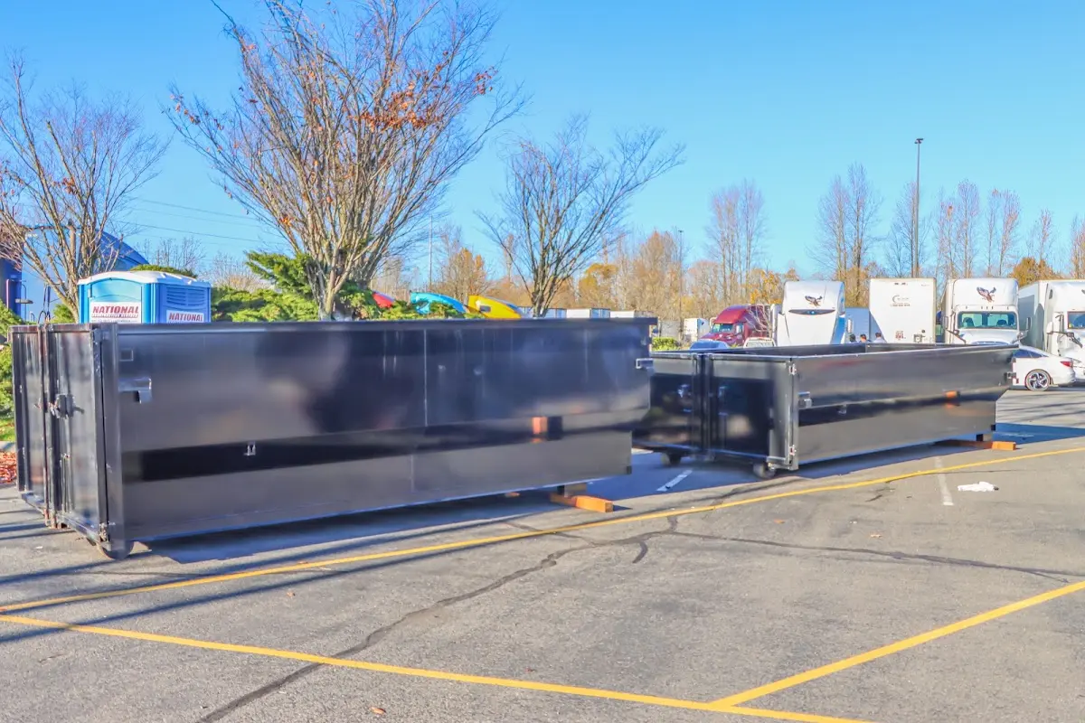 Professional dumpster rental service with roll-off container on residential driveway in Silver Springs Shores